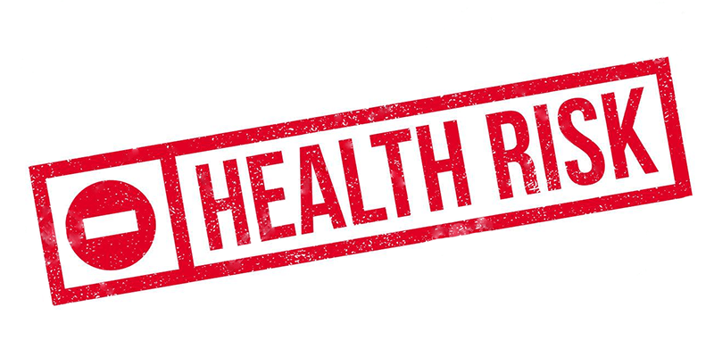 A red rectangular stamp with the words "HEALTH RISK" and a warning symbol on a white background, indicating potential danger or hazard.